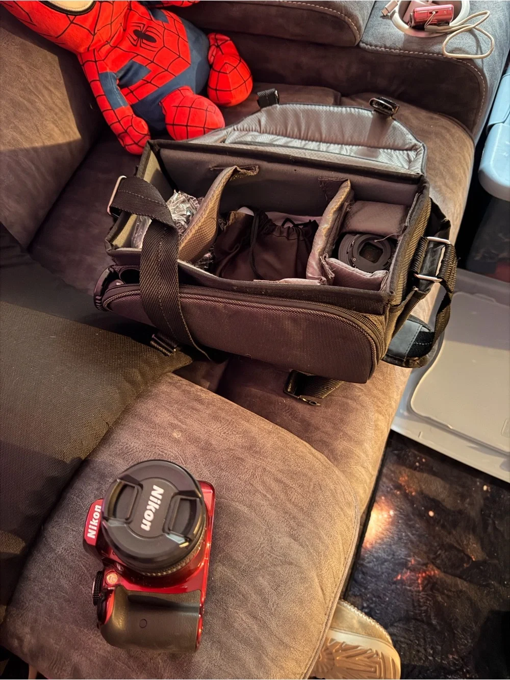 Nikon red DSLR with Nikon lens cap
